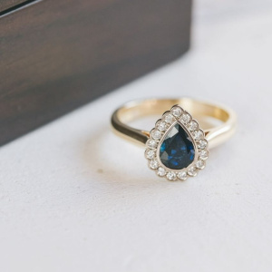 Scalloped Halo Pear Cut Sapphire and Diamond Ring