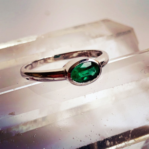 Horizontally Set Oval Cut Emerald White Gold Ring